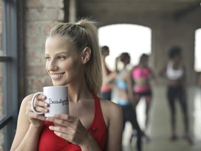 A group of people smiling after a workout session.